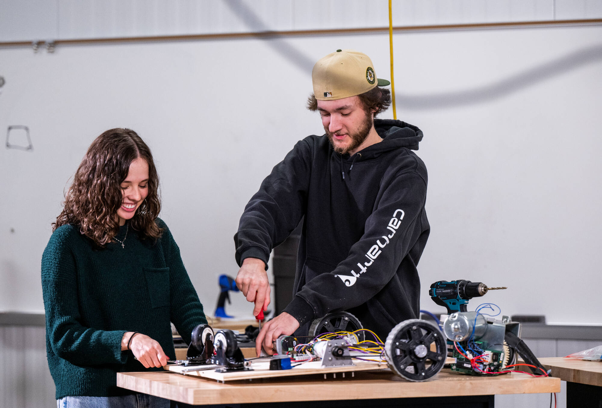 From left, Abby Robbins (biomedical engineering graduate student) and Alec Kent (product design and manufacturing engineering)(Photo releases on file)